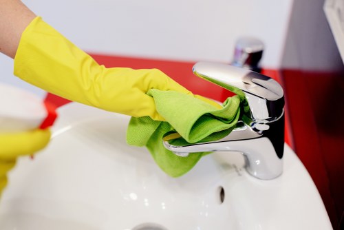 Cleaning worker following safety procedures with protective equipment